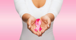 hands holding pink breast cancer awareness ribbon 38429938